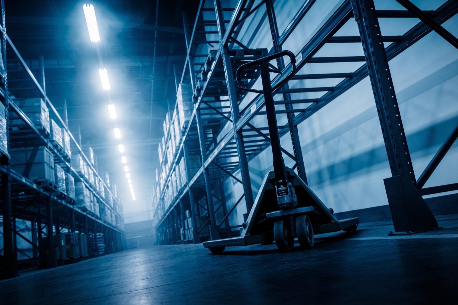 Illustrative: a distribution warehouse with racking and a forklift